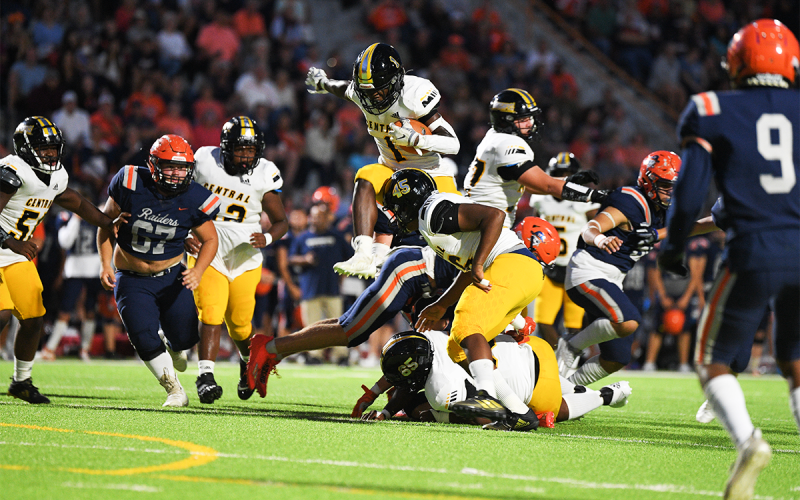 Central Gwinnett’s Jason Jackson leaps over blockers and defenders on his way to a first-half touchdown against Habersham Central on Friday night. TOM ASKEW/Special