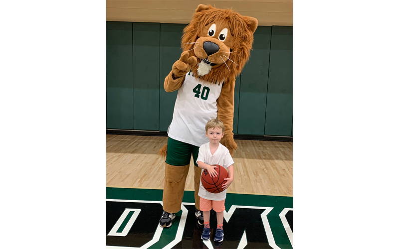 Cole Arnold hangs with Leo the Lion. RACHEL PLEASANT/Submitted