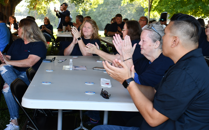From left, Misty Yeadon, Angela Savage, Tajuana Watts, Mary Brotherton and Rodney Phongsavanh applaud during Scovill’s 220th anniversary celebration Wednesday. BRIAN WELLMEIER/Staff