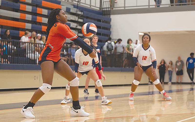 Habersham Central’s Amayah Dooley hits a bump to teammate Jazky Bantaum during the Lady Raiders’ third set against Jackson County earlier this season. ZACH TAYLOR/Special