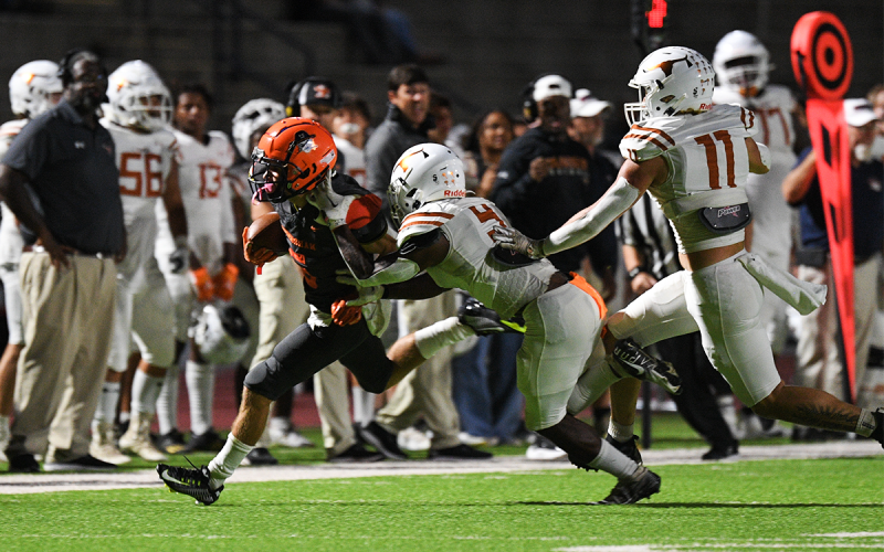 Habersham Central’s Zeke Whittington tries to escape a Lanier tackler during Friday night’s game. TOM ASKEW/Special