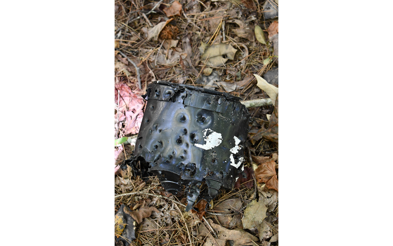The crime scene – some 200 yards off the road near the intersection of Victory Home Lane and Georgia Highway 15 – is still littered with remnants of whatever happened that fateful weekend of Sept. 10-11. ALAN NESMITH/Staff