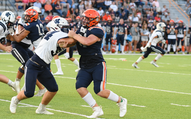 Habersham Central ‘s Garrett Turner mixes it up with a White County lineman during the Aug. 26 game. TOM ASKEW/Special