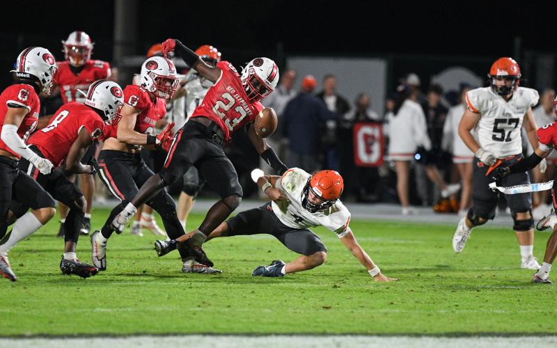 Gainesville’s Carmelo Byrd (23) rips the ball out from the grasp of Habersham Central’s Carson Parker during Friday night’s game at City Park in Gainesville. TOM ASKEW/Special