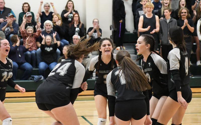 Tallulah Falls players celebrate a point on Saturday against Mt. Pisgah. From left are Kitty Rodenas (running in), Addy McCoy, Chloe Kahwach, Sarah Jennings, Elsa Sanchez and Rebecca Heyl. MATTHEW OSBORNE/Staff