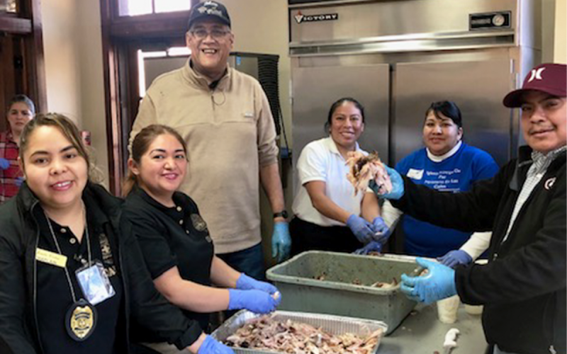Pastor Samuel Negron, standing in the back, and members of his church, Iglesia Principe De Paz serve at a previous Community Thanksgiving Dinner. SUBMITTED