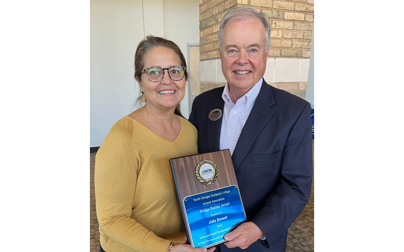 From left are Julia Barnett, NGTC Bridge Builder Award winner; and NGTC president, John Wilkinson. AMY HULSEY/Submitted