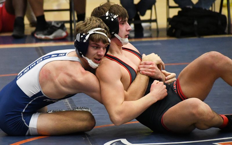 Habersham Central senior Caleb Blackburn (left) locks up his opponent during the Raider Invitational last weekend. MATTHEW OSBORNE/Staff
