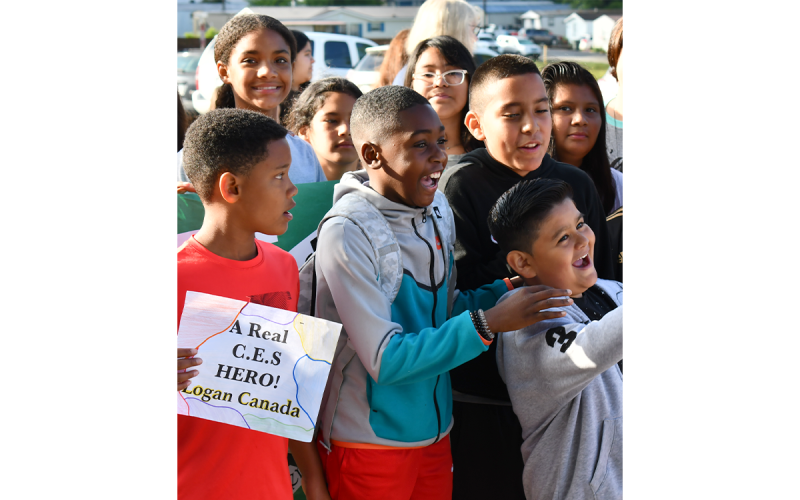 Logan Canada (second from left) exhaults with friends at his hero’s welcome at Cornelia Elementary. MATTHEW OSBORNE/Staff