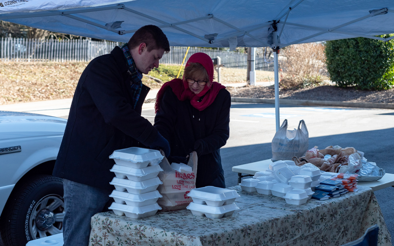 Sean and Cameron Nix prepare meals for drive-thru customers in the freezing cold. E. LANE GRESHAM/Special