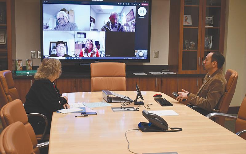 Habersham Medical Center CEO Tyler Williams and executive assistant Phyllis Brooks prepare to meet with the Hospital Authority by Zoom on Monday afternoon. MATTHEW OSBORNE/Staff