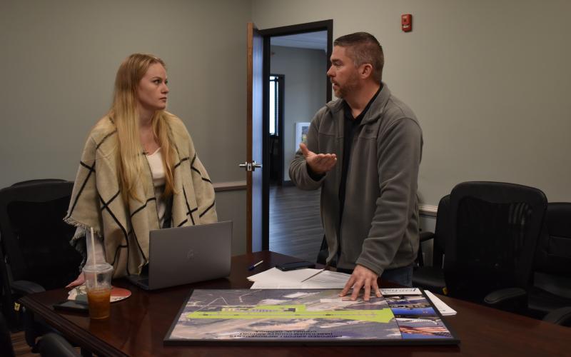 Habersham County Grant Coordinator Lauren Long discusses the future of Habersham County Airport with Airport Manager Will Regan on Thursday. EMMA MARTI/Staff