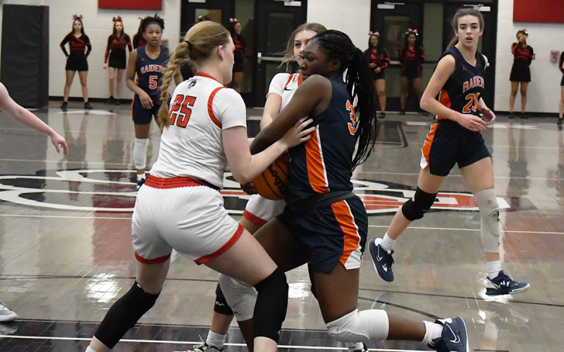 Habersham Central’s Sataria Cantrell battles a Jackson County player for possession. MATTHEW OSBORNE/Staff