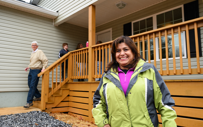 Habitat for Humanity Volunteer Silvia Corwin stands proudly in front of the new house, which she helped paint. ZACH TAYLOR/Special