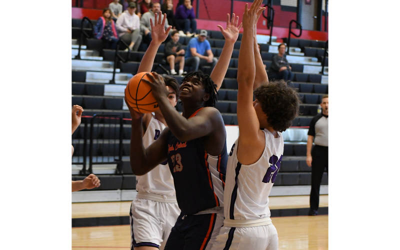 Habersham Central’s JoJo McCurry is surrounded by defenders against  Walhalla in the Raiders’ last game before the new year. MATTHEW OSBORNE/Staff