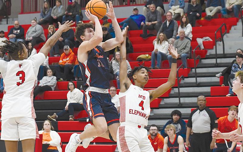 Habersham Central's Cole Gary floats in the air on the way to the basket Friday night.