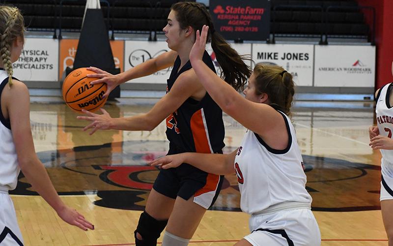 Habersham Central's Kyia Barrett dishes to a teammate during the Battle of the Borders tournament.