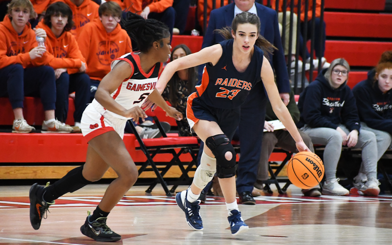 Kyia Barrett (left) and the girls won 48-46. MATTHEW OSBORNE/Staff