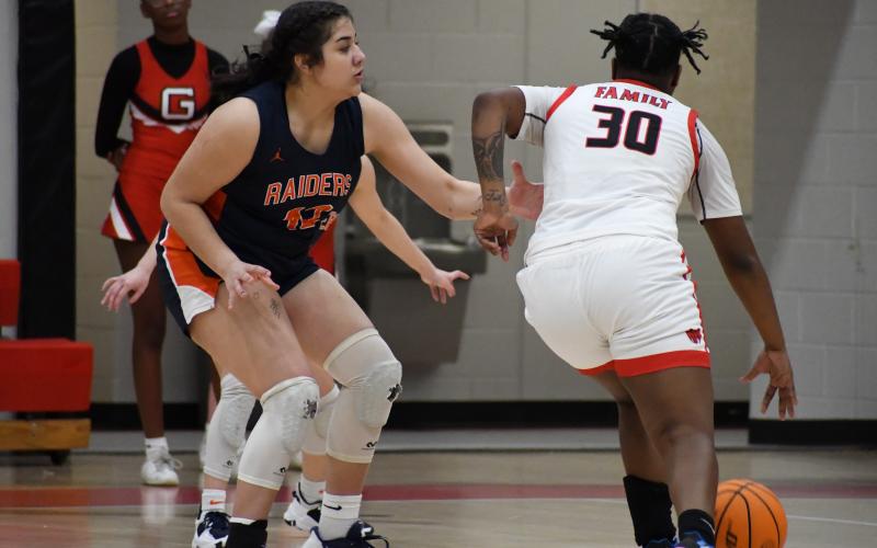 Habersham Central’s Gabby Santiago (left) defends a Gainesville’s Kedra Young during Friday night’s game. MATTHEW OSBORNE/Staff
