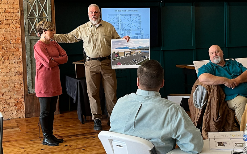 Sheriff Joey Terrell makes a presentation Friday while County Manager Alicia Vaughn (left), Commissioner Bruce Palmer (right) and Chairman Ty Akins listen. JOHN DILLS/Staff