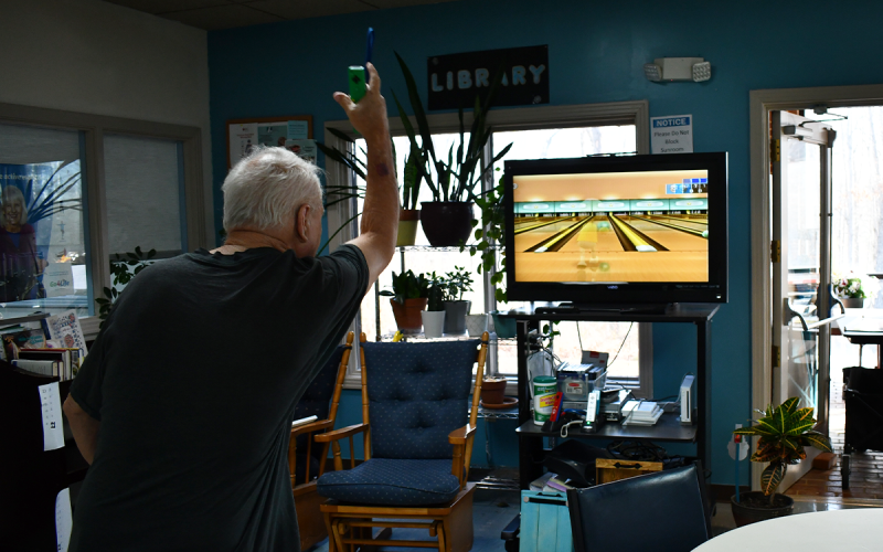 Kenneth  Williams  follows through on  his shot during Wii Bowling practice on Tuesday at the Senior Center. JOHN DILLS/Staff