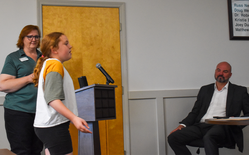 Clare Rutter, who won first place in the Performing Arts Vocal category at Rock Eagle’s Project Achievement event in February, performs the song “Almost There” from the Disney movie, “The Princess and the Frog” as Renee Smagur, Habersham County 4-H Program Assistant and Superintendent Matthew Cooper listen. EMMA MARTI/Staff