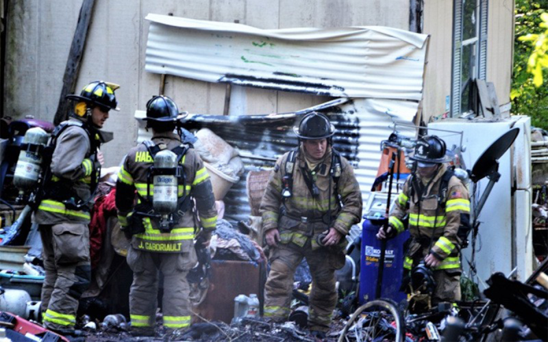 Habersham County and Baldwin firefighters sift through debris to ensure no additional hotspots following Monday night’s fire on Burning Bush Drive. HABERSHAM COUNTY/Submitted