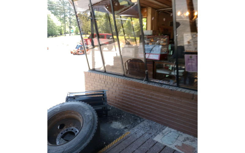 The front window of Cowboy Bob’s was broken by a stray truck tire from an accident Monday afternoon. PAULA KUBINCHAK/Submitted