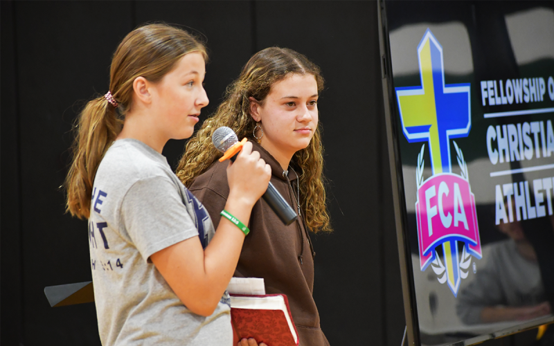 Tallulah Falls students Gracie Gunter and Carsyn Griffis gave testimony at Wednesday’s Fields of Faith FCA event. MATTHEW OSBORNE/Staff