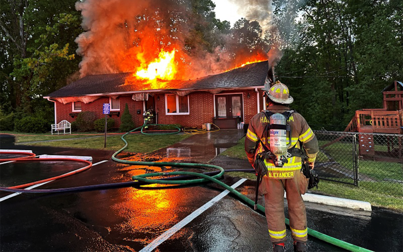 Habersham County Emergency Services Battalion Chief Michael Alexander monitors the effectiveness of the firefighting operations at the Hollywood Baptist Church pastorium Monday morning. HABERSHAM COUNTY/Submitted