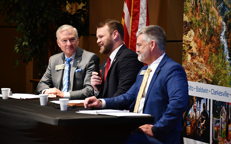 Habersham County state legislators (from left) Rep. Chris Erwin, Sen. Bo Hatchett and Rep.  Victor Anderson talk at Wednesday’s legislative breakfast at Habersham EMC. MATTHEW OSBORNE/Staff