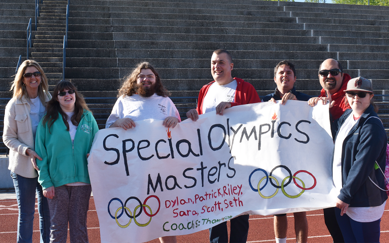 Shown are (from left) Masters Athlete Leader Tracey Clarke alongside Masters Athletes Riley Clarke, Dylan Clarke, Scott Simmons, Patrick Quillan, Seth Flores and Sara Kirschner. These athletes are graduated students who return year after year to compete in the Special Olympics. EMMA MARTI/Staff