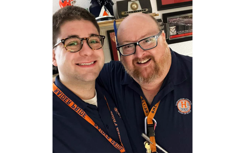 The torch is officially passed from former Band of Blue director Ryan Dukes (right) to current director Jacob Weinstein. NELSON PAYNE/Submitted