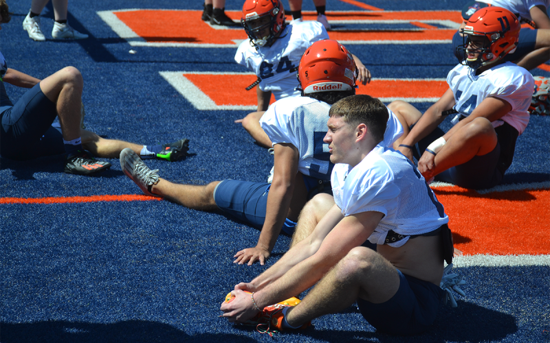 Rising senior Carter Barrett visualizes how this season will go while stretching. MATTHEW OSBORNE/Staff