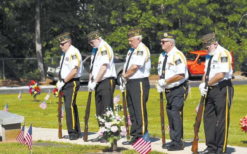 Grant-Reeves Honor Guard members (from left) Rob Wallace, Roy Albea, Barry Church, Ronnie Dotson and Bob Trousdale bow their heads while listening to the Memorial Day remarks Monday morning, MATTHEW OSBORNE/Staff