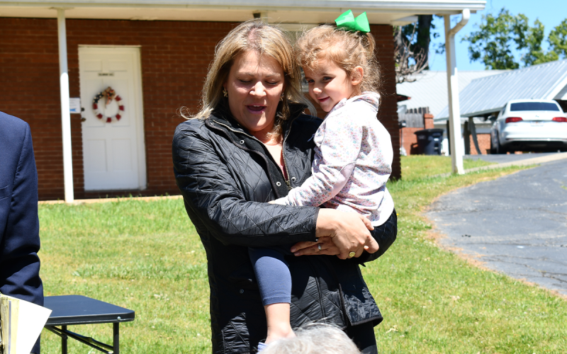 Christina Criser Jackson and her daughter, Olivia Jackson, say a prayer over Habersham’s plentiful community. JOHN DILLS/Staff