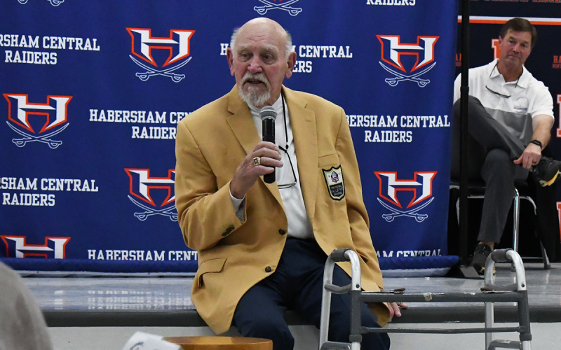 Pro Football Hall of Famer Billy Shaw speaks at Thursday’s Ring of Honor  banquet at the Ninth Grade Academy, as WCON’s David Foster listens.