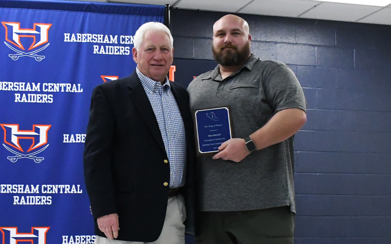 Matt Burrell (right) was presented by Coach Theo Caldwell. LANG STOREY/Staff