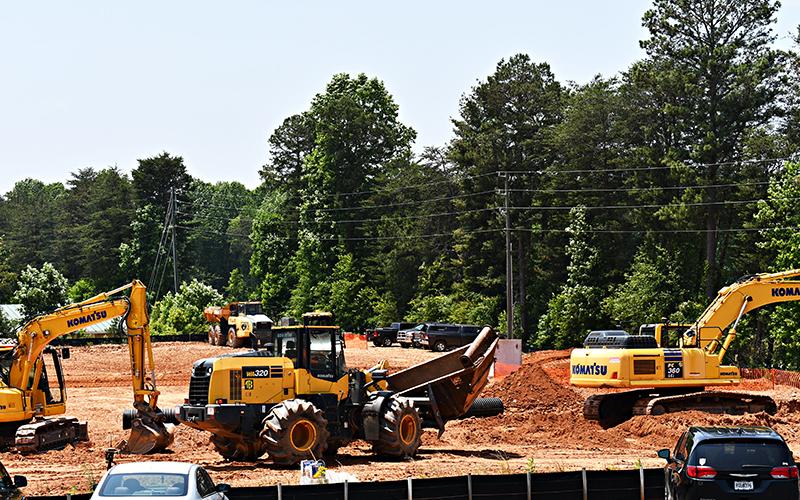 Construction vehicles prepare the land for the future Cornelia Marriott across the street from the current Hampton Inn.