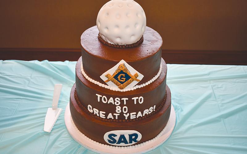 Larry Whitfield's birthday cake celebrates the many aspects through which he is involved in the community.