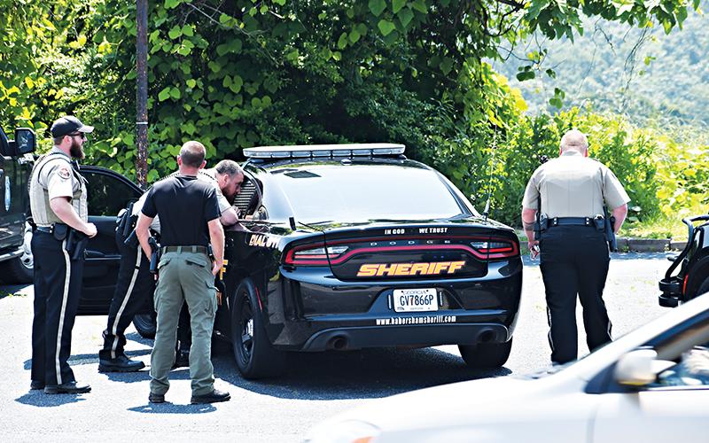 Habersham County Sheriff’s deputies help arrest Devonte Jenkins of Dalton on Wednesday afternoon.