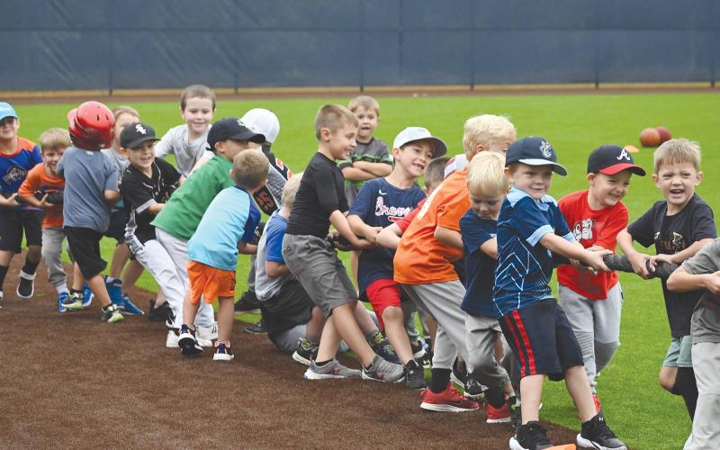 The campers pull their weight during a tug of war. LANG STOREY/Staff
