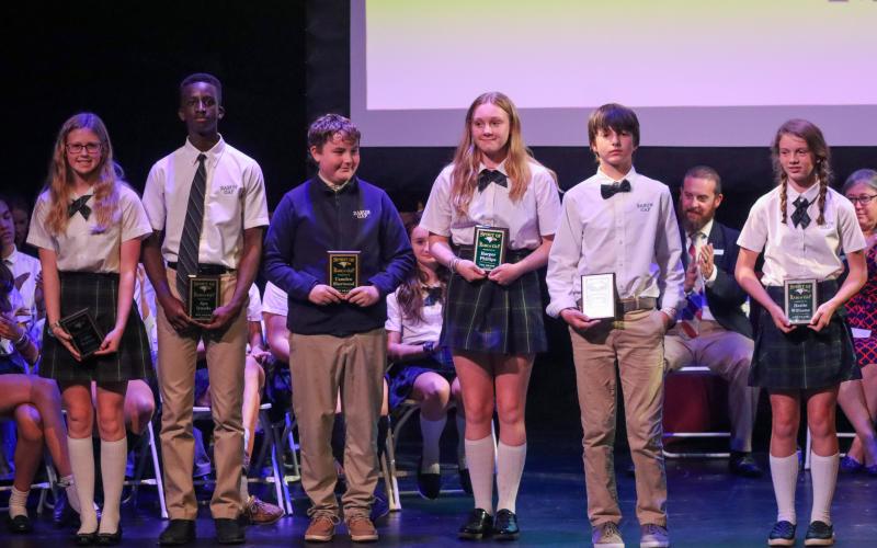 The Spirit of Rabun Gap award honorees were sixth-graders Asa White of Rabun Gap and Hattie Williams of Demorest; seventh-graders Harper Phillips of Rabun Gap and Camden Sherwood of Franklin; and eighth-graders Ayo Iyanda of Atlanta and Callie Parker of Franklin, N.C. Shown (from left) are Parker, Iyanda, Sherwood, Phillips, White and Williams.