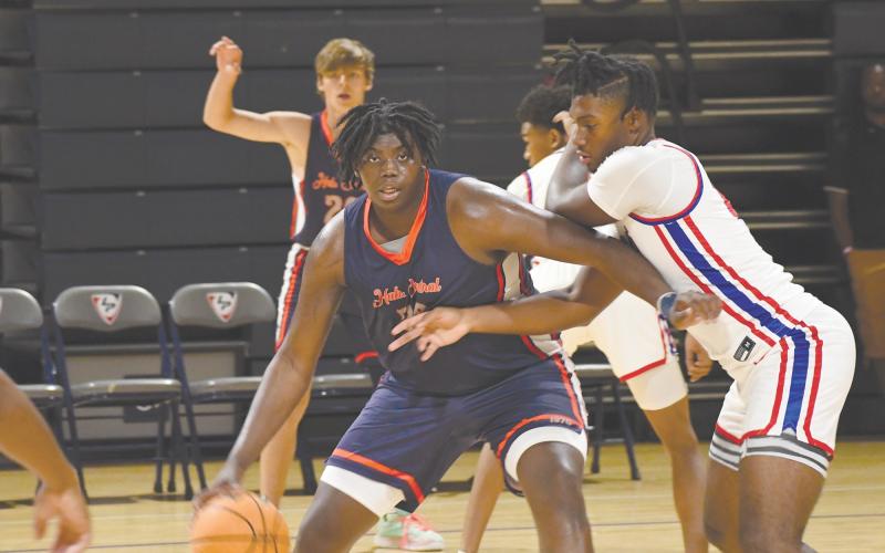 Habersham Central’s JoJo McCurry backs down his man during summer league play over the weekend. LANG STOREY/Staff
