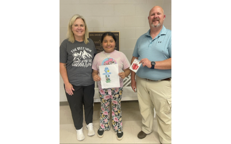 Winners from Level Grove Elementary School are (from left) art teacher Tonya Church and Arizeth Olguin Saldivar, shown with City Manager Donald Anderson. VICKI VINSON/Submitted