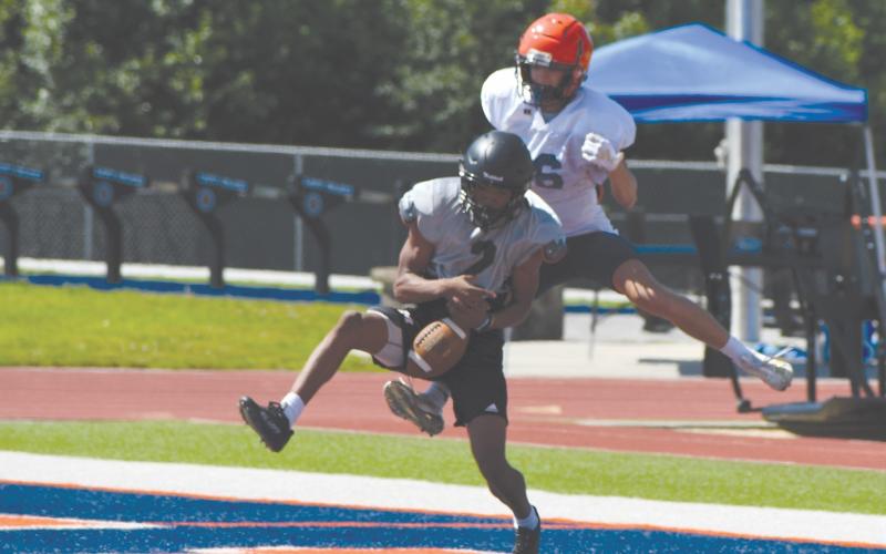 A Madison County defender breaks up a pass intended for Maverick Chitwood in the end zone. LANG STOREY/Staff