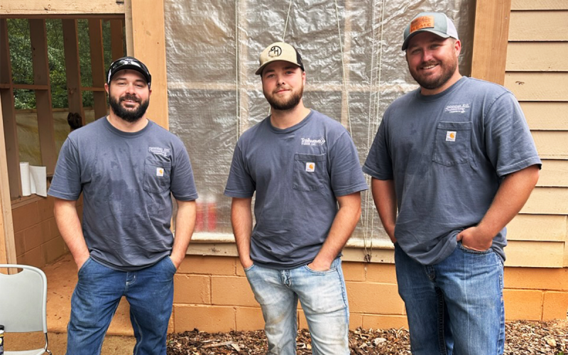 The crew from Habersham EMC who helped cook chicken included (from left) Stephen Thomas, Landon Price and Cody Thomas. JENNIFER BURTON/Submitted