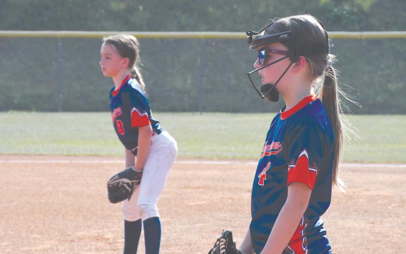 Anistyn Patrum and Joanna Neeley wait for the ball to be hit.