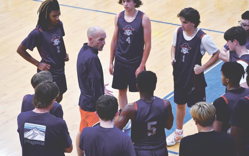 Raiders coach Tommy Yancey breaks it down for the fellas. LANG STOREY/Staff