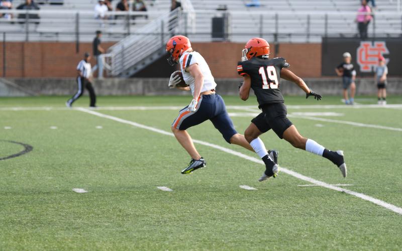 Habersham Central’s Jonah Wilson runs away from a Hart County defender during the spring game. The fall preseason game is just nine days away.  TOM ASKEW/Special